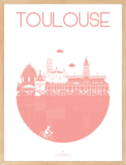 Affiche "Toulouse – La Ville" en rose, encadrée en bois clair, dans un intérieur lumineux.